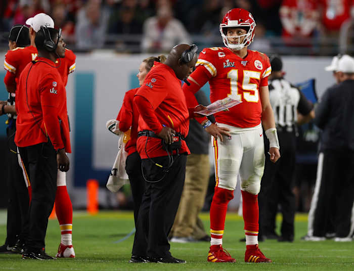 Feb 2, 2020; Miami Gardens, Florida, USA; Kansas City Chiefs quarterback Patrick Mahomes (15) with offensive coordinator Eric Bieniemy during a timeout from the game against the San Francisco 49ers in Super Bowl LIV at Hard Rock Stadium. Mandatory Credit: Matthew Emmons-USA TODAY Sports